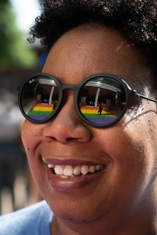 Buzz is reflected in Christen Steele’s glasses as she admires the Progress Pride Staircase at the Klaus Advanced Computing Building. Photo by Allison Carter