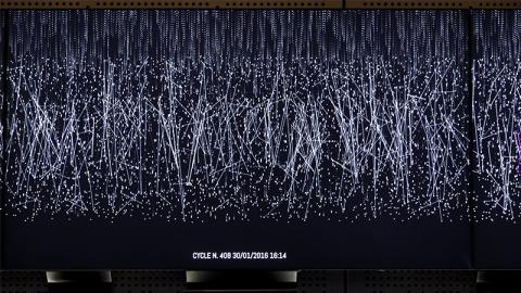 thousands of white points of light on a dark screen