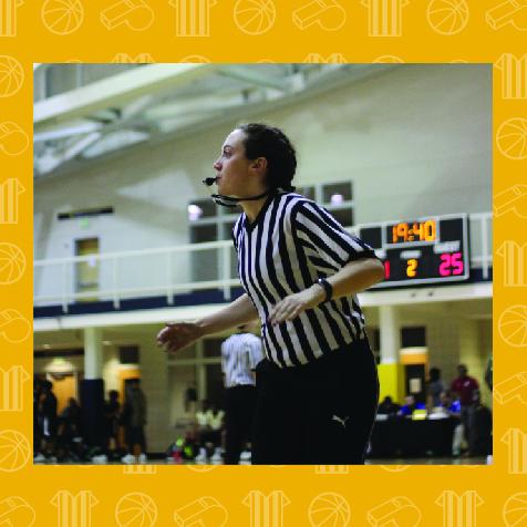 female basketball official blowing a whistle