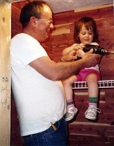 Brittney English at the age of three with grandfather Bob English.