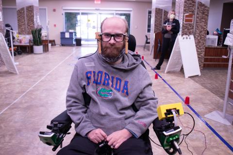 man in wheelchair with magtrack device
