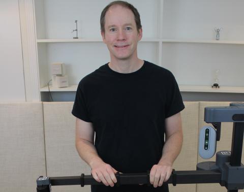 Professor Charlie Kemp with his robot, Stretch.
