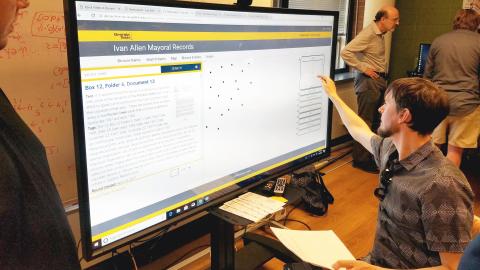 Assistant Professor Todd Michney demonstrates a portal for researching the papers of former Atlanta Mayor Ivan Allen Jr.