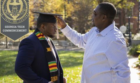 Adjusting a graduate's tassel before Fall 2020 Commencement