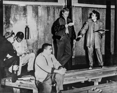DramaTech's first long-lasting artistic director, Mary Neil Santaroce, directs students preparing for a performance in this archival photograph.
