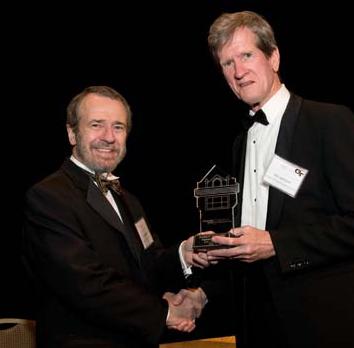 Ellis Johnson (right) accepts Distinguished Engineering Alumni Award from Dean Giddens