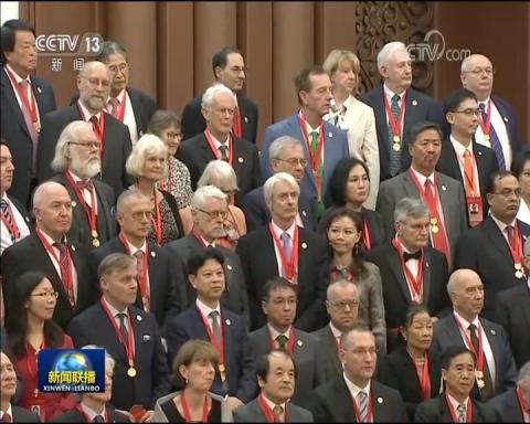 Group photo of some of the 100 Friendship Award recipients on China Day, September 30, 2019.