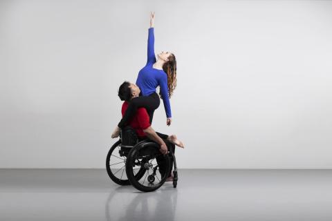Full Radius Dance dancers, Juliana and Peter together in a photography studio photoshoot representing physically integrated dance.