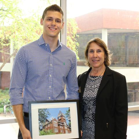 Graham Burke, winner of the Evelyn Pennington Oustanding Service Award, with Academic Advisor Fran Buser
