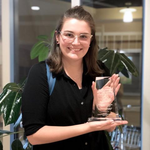 Kayleigh Haskin receives the Outstanding Undergraduate Research Award at the Spring 2019 UROP Symposium.
