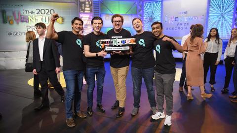 Team Queues with the first-place trophy after winning the 2020 InVenture Prize competition. (Photo: Christopher Moore)