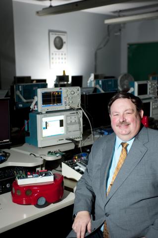 photograph of Joseph L.A. Hughes in ECE 2031 lab