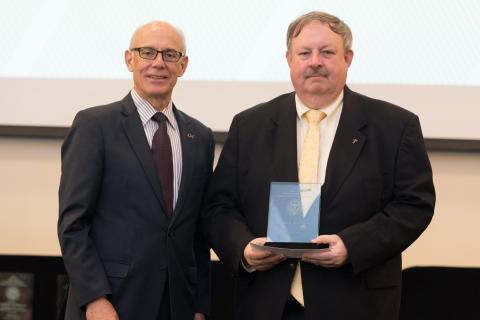 photograph of Joseph L.A. Hughes, recipient of the 2018 Georgia Tech Outstanding Service Award, with Provost Rafael Bras