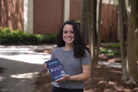 Maria Warren holds her copy of BUILT, the book she selected to kickoff the book club she created for the CEE Community. Photo: Amelia Neumeister