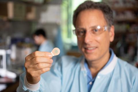 Inventor holds tattoo patch