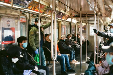 People riding subway