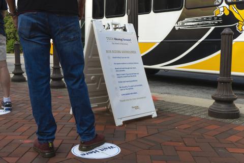 Students board a bus at Georgia Tech. 