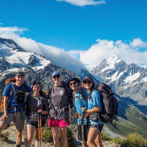 Image of participants on ORGT trip to New Zealand with mountains.