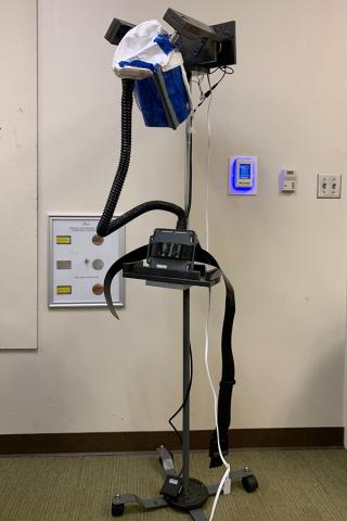 The PAPR MagStand created by a spring 2021 Capstone Design team in biomedical engineering. The stand allows busy hospital workers to quickly and safe put on and remove a Powered Air-Purifying Respirator (PAPR) with minimal contact, reducing the chances of contamination.