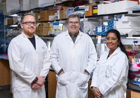 Three Georgia Tech researchers in the lab