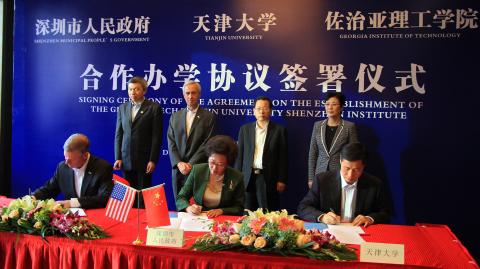 Georgia Tech President G.P. "Bud" Peterson signs new educational agreement with city of Shenzhen, China, and Tianjin University.