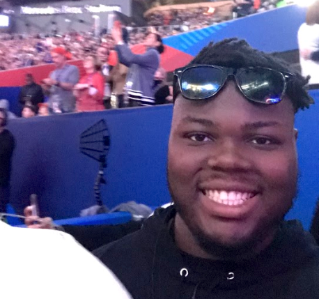 CS Major Christopher Payne smiling for a selfie at Super Bowl LIII