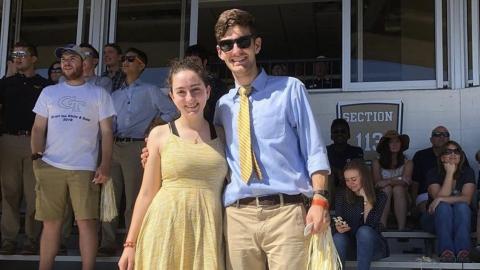 Teresa Muñoz and her brother Alejandro Muñoz, MSE 2019, at a homecoming football game.