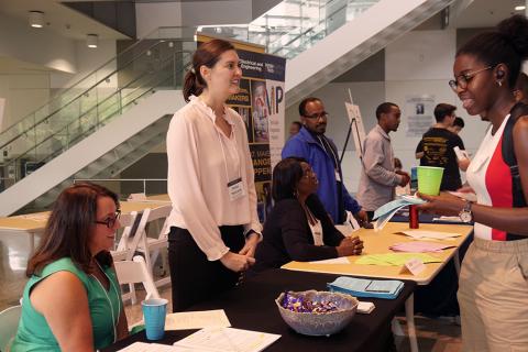 Christina Bourgeois and Anna Holcomb tell students about the UPCP and its offerings at ECE Rush.
