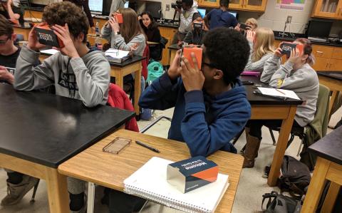 High school students using cardboard virtual reality viewers as part of Georgia Tech research study