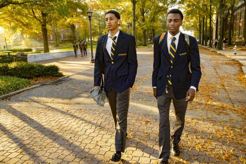 two students walking across campus