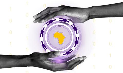 Two hands holding a circle with Africa in the middle of it.
