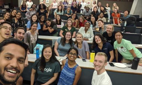 Students taking a selfie at a Society of Women Engineers meeting.