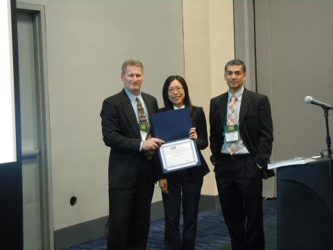 Chia-Jung Chang accepting her award with Associate Professor Roshan Vengazhiyil (R)