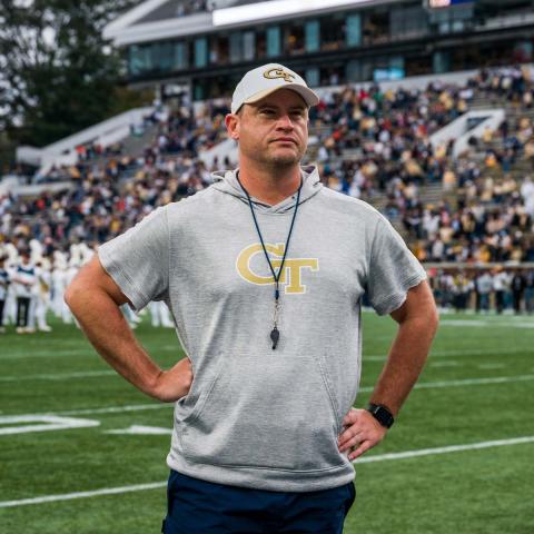 photo of Coach Key with arms on hips