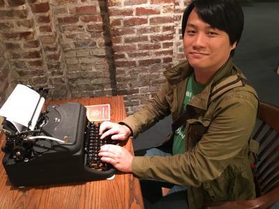LingMing Huang at a typewriter.