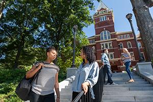 student talking on steps outside of Tech Tower