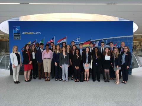A photo of Students particpating in the EU Study Abroad Program pose at the NATO headquarters in Brussels, Belgium.