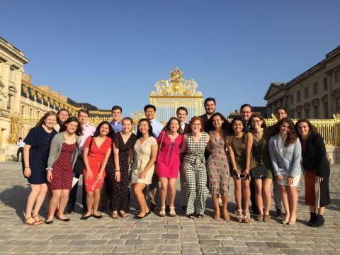 Group photo of students outside the gates of Versailles