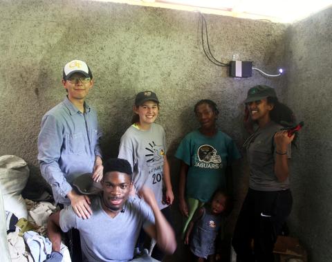 ORS Team inside the 2nd house with the owner and her daughter.