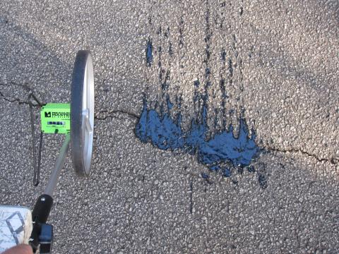 Crack sealed by GTRI's prototype automated pavement crack detection and sealing system (1)
