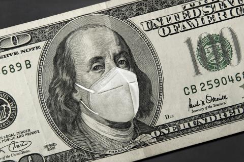 Stock image of a $100 bill with a mask