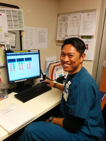 Emory Winship Triage nurse using the Real-time Visibility Tool to seat a patient.