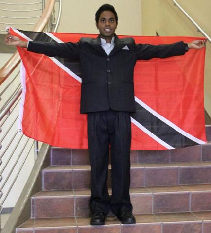 Kiran Rampersad with the Trinidad & Tobago National Flag