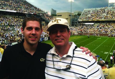 Matlock, IE 2011, and Ed Rogers, IE 1982, MS IL 2002, enjoying a Georgia Tech football game in 2012. Ed is a director of Global Strategy at UPS and Matlock works for Anheuser-Bush as a project manager.