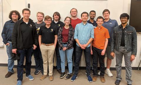 RoboJackets Founder Brad Geving meets with current members during the RoboJackets 20th-anniversary celebration held March 30.