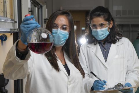 Graduate research assistants with chemicals