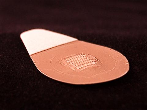 Closeup of microneedle patch for influenza vaccination