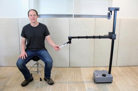Professor Charlie Kemp with his robot, Stretch.