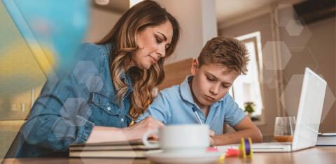Mom works from home while helping son with homeschool