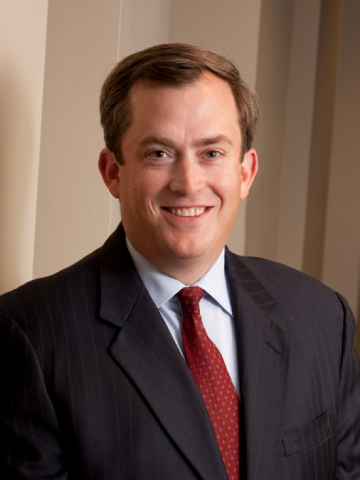 A portrait photo of Robbie Ashe III